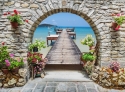 Sea view through a stone arch 